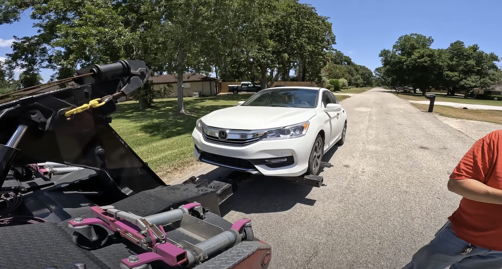 Professional tow truck providing roadside assistance to stranded vehicle